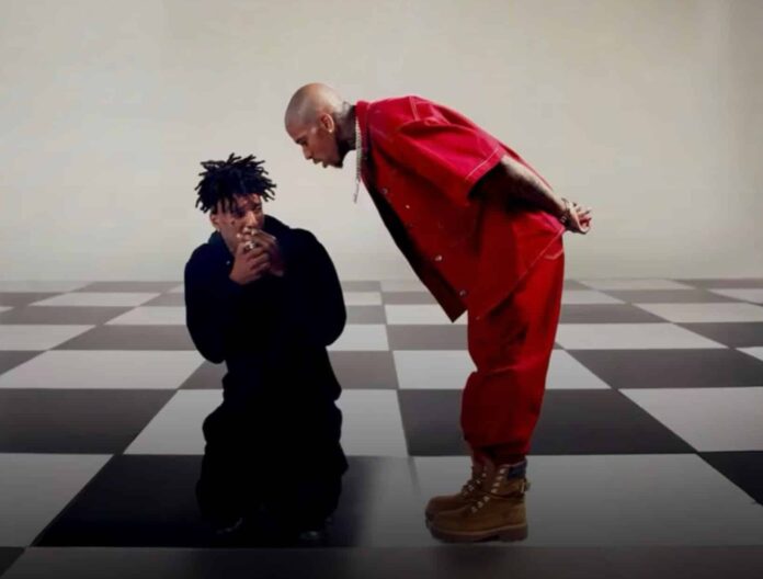 NLE The Great standing over an opponent in a dramatic scene from the “KO” music video, directed by Bryson Potts & Travis Payne, produced by Spittn Image. Used under Fair Use for news reporting and cultural commentary.