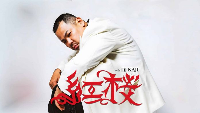 BENIZAKURA crouching in a white suit and holding a black hat, with a large red logo and the words with DJ KAJI