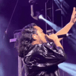 Creepy Nuts rapper R-Shitei performing on the Gobi Stage at Coachella 2026