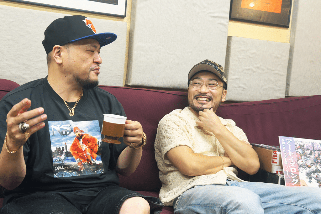 MEGA-G and Greedy on ILLBLOCK talking on a sofa