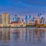 Philadelphia skyline at dusk reflected in the Delaware River, photographed in 2019